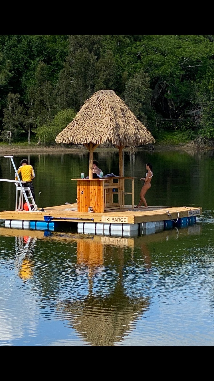 Floating Tiki Bar Pavilion on Lake with Palm Thatch