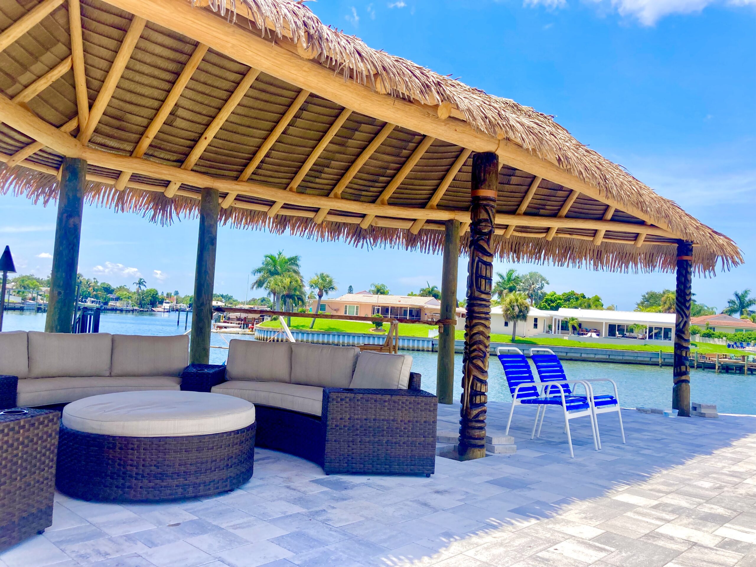 Waterfront Tiki Pavilion with Palm Thatch and Lounge Seating