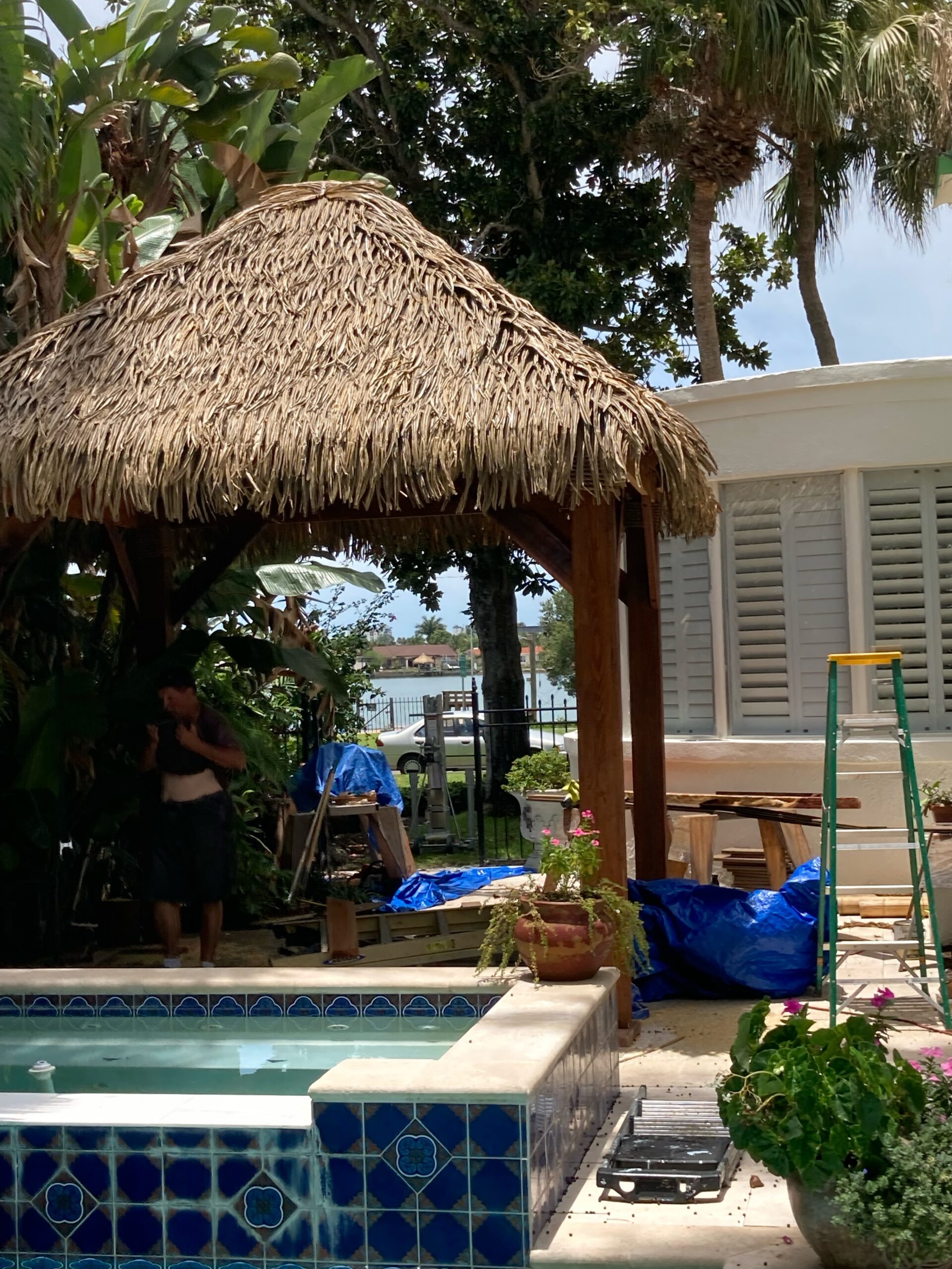 Backyard Tiki Hut with Palm Thatch and Seating