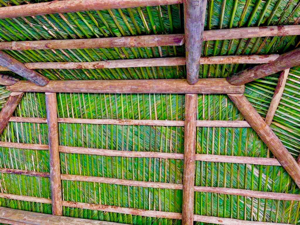 Tiki Hut Roof Detail with Palm Thatch Weave & Cypress Beam