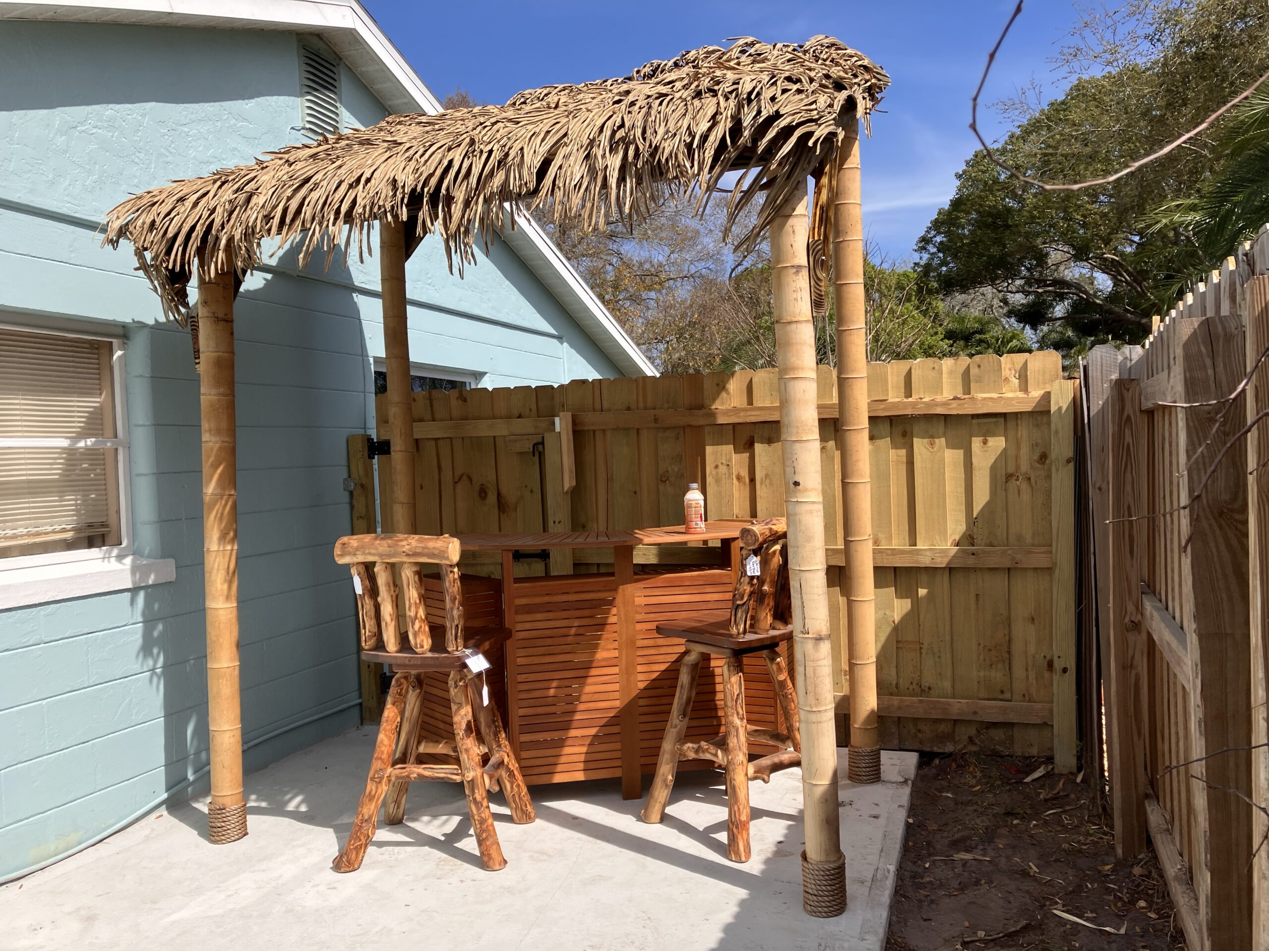 Compact Backyard Tiki Bar with Palm Thatch Roof