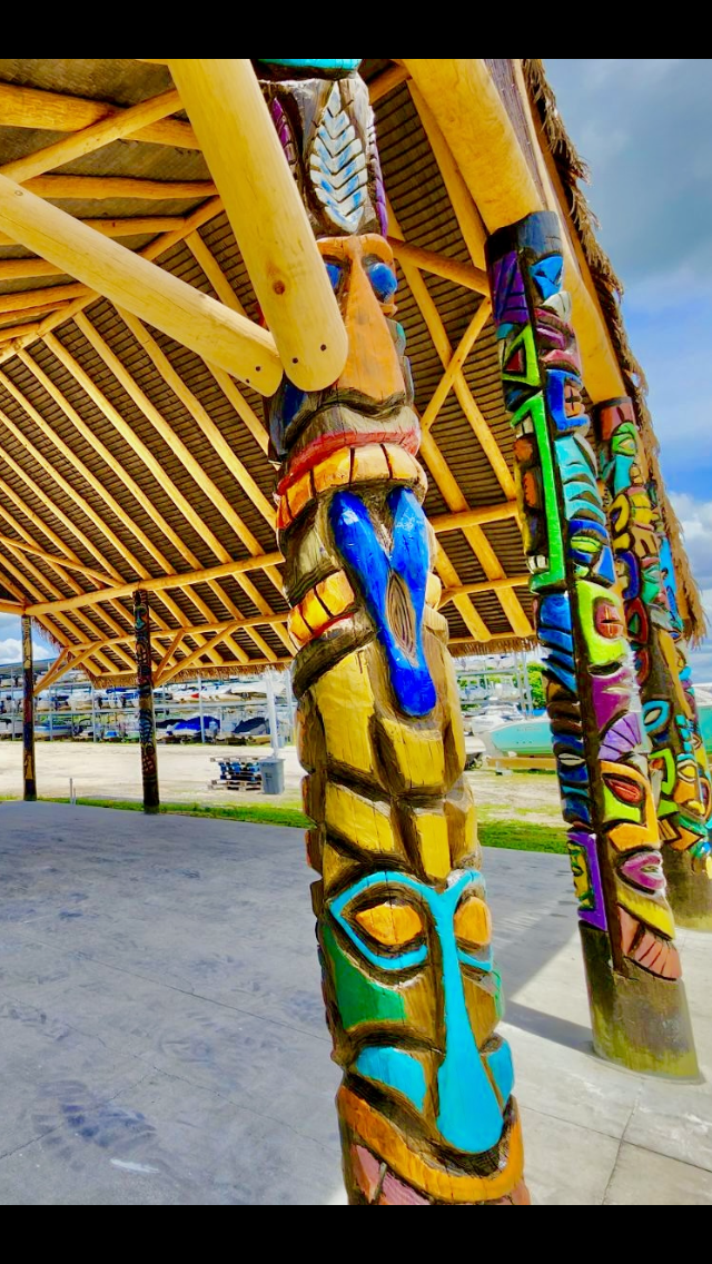 Tiki Hut Roof Detail with Bamboo Rafters & Carved Tikis